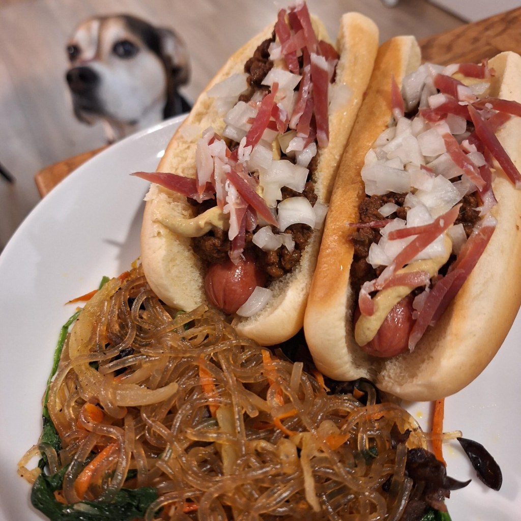 “Delicious Homemade Japchae and Chili Dogs with Jamon”